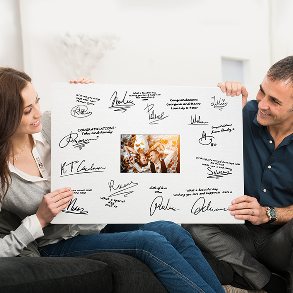 couple holding signature board example image